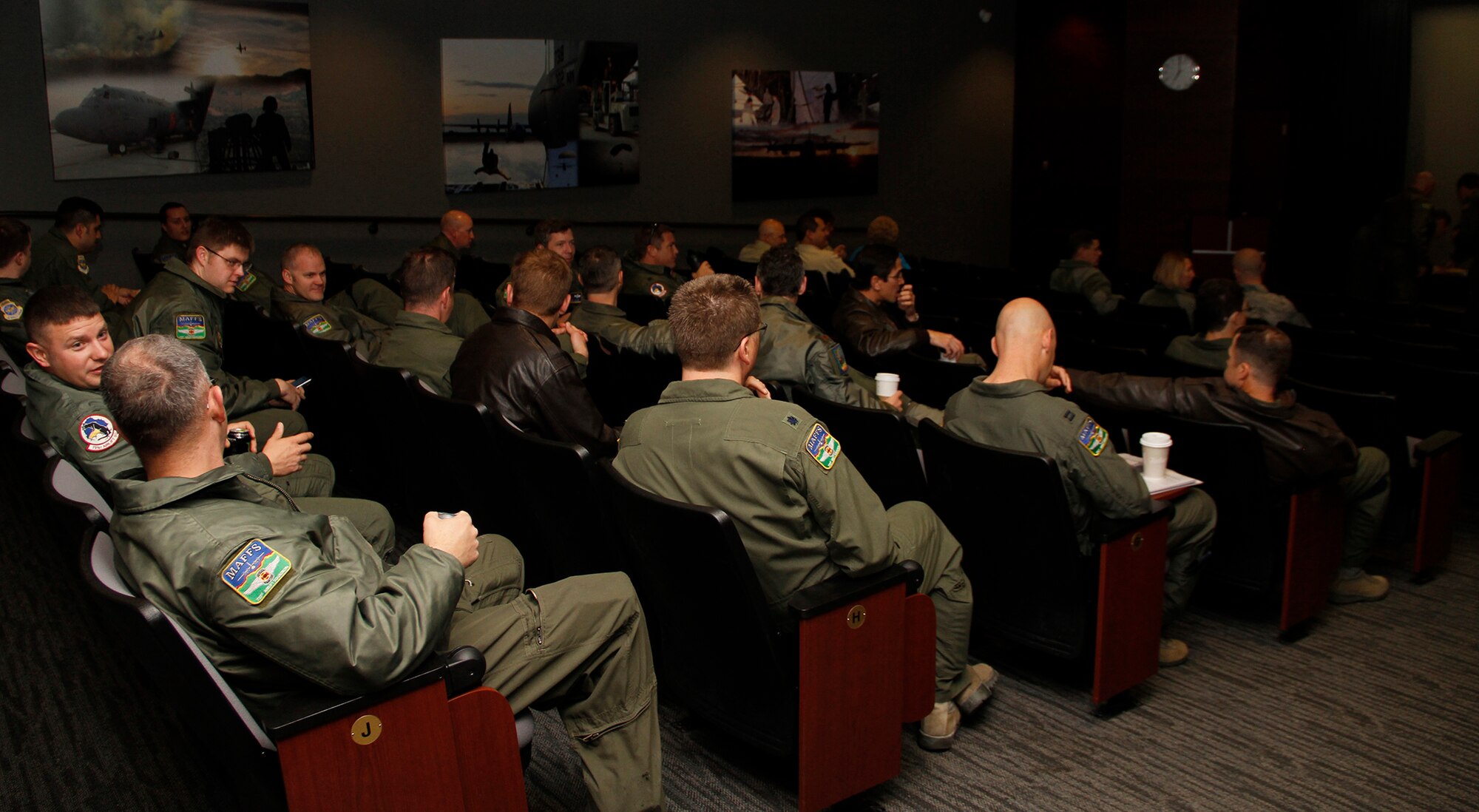 Aircrews of the 302nd Airlift Wing gather for a morning briefing during Modular Airborne Fire Fighting System training April 22. The Air Force Reserve Command’s 302nd AW held its annual MAFFS certification and re-certification for C-130 aircrews April 19-23. When it is determined MAFFS is needed, the National Interagency Fire Center through U.S. Northern Command requests the DOD's U.S. Air Force resources. These trained military personnel along with the MAFFS equipment are activated to supplement the civilian air tanker program during periods of high wildfire activity throughout the nation. In 2012 the 302nd AW MAFFS-equipped C-130s, aircrew and personnel supported fire suppression operations in 10 states, including drops on the Waldo Canyon fire near Colorado Springs. 2013 marks the 20th year the MAFFS mission has been flown by the Airmen and C-130s of the 302nd AW. (U.S. Air Force photo/Staff Sgt. Nathan Federico)