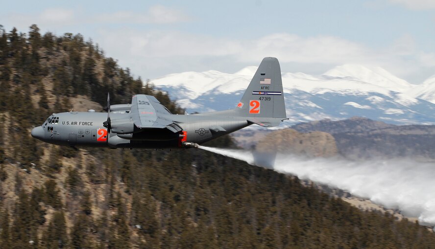 A Modular Airborne Fire Fighting System-equipped C-130 from the 302nd Airlift Wing drops a load of water April 22 near Fairplay, Colo. The Air Force Reserve Command’s 302nd AW held its annual MAFFS certification and re-certification for C-130 aircrews April 19-23. When it is determined MAFFS is needed, the National Interagency Fire Center through U.S. Northern Command requests the DOD's U.S. Air Force resources. These trained military personnel along with the MAFFS equipment are activated to supplement the civilian air tanker program during periods of high wildfire activity throughout the nation. In 2012 the 302nd AW MAFFS-equipped C-130s, aircrew and personnel supported fire suppression operations in 10 states, including drops on the Waldo Canyon fire near Colorado Springs. 2013 marks the 20th year the MAFFS mission has been flown by the Airmen and C-130s of the 302nd AW. (U.S. Air Force photo/Staff Sgt. Nathan Federico)