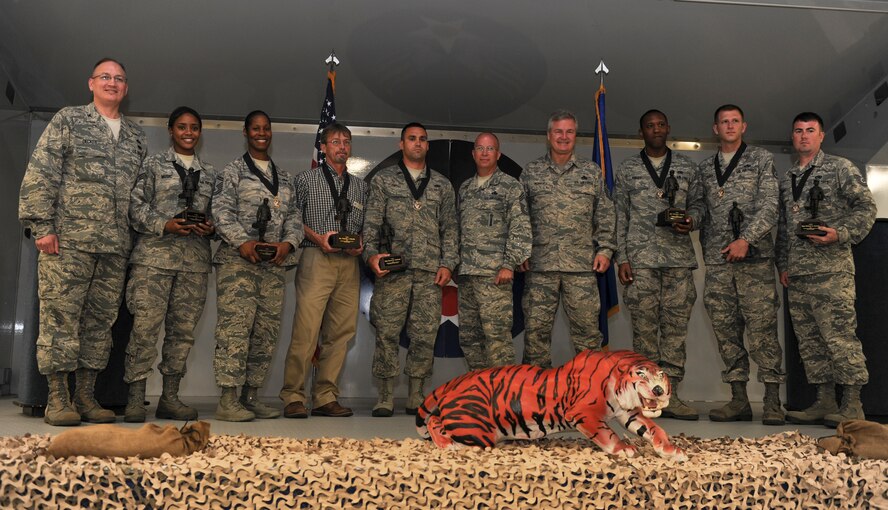 Airmen recognized as maintenance professionals of the year gather for a group photo with Col. Jeffery Decker, 23d Maintenance Group commander, and retired Chief Master Sgt. of the Air Force Gerald Murray during the 2013 Maintenance Professional of the Year banquet at Moody Air Force Base, Ga., April 19, 2013. The winners were recognized for their outstanding work performance in 2012. (U.S. Air Force photo by Airman Alexis Grotz/ Released)  