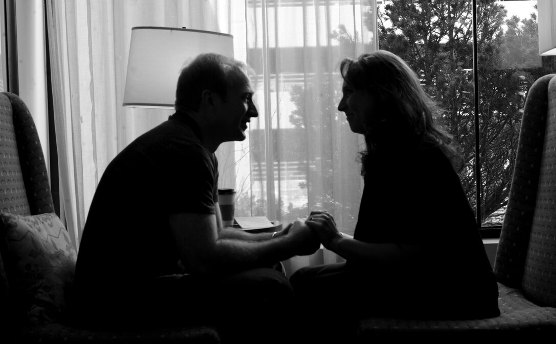 Maj. Bryan Kemper, 28th Medical Operations Squadron chief of optometry services, holds hands with his wife of nine years, Richelle, during a marriage care retreat exercise in Denver April 20, 2013. The four-day retreat consisted of seminars focused on the dynamics of marriage and allowed couples to spend time with one another and deepen their relationships. (U.S. Air Force photo by Airman 1st Class Anania Tekurio/Released) 