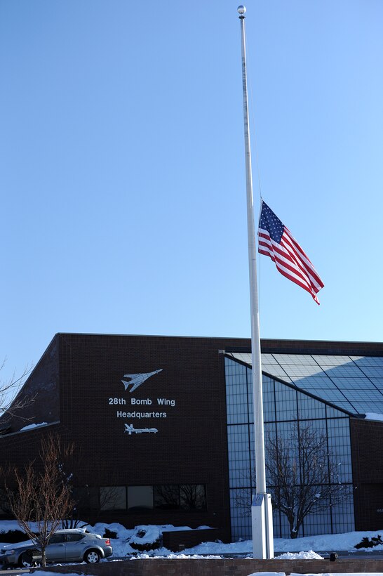 The flag stands at half-staff in honor of Maj. Gen. Joseph Brown IV at Ellsworth Air Force Base, S.D., April 23, 2013. Brown and his wife, Sue S. Brown, were killed April 19 when the Cessna 210 he was piloting crashed in Williamsburg, Va. During his career Brown served in a variety of positions, including commander of the 28th Operations Group and 28th Bomb Wing at Ellsworth. (U.S. Air Force photo by Airman 1st Class Hrair H. Palyan/Released)