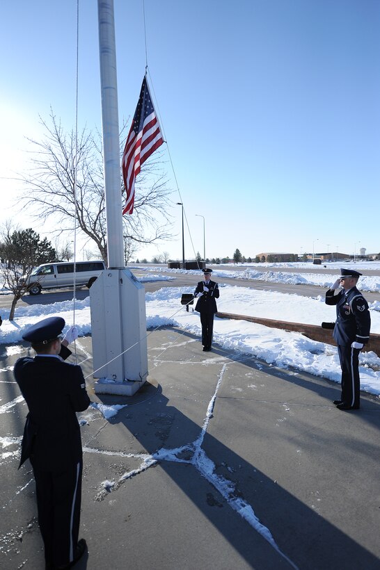 Ellsworth Honor Guard members raise the base flag in honor of Maj. Gen. Joseph Brown IV at Ellsworth Air Force Base, S.D., April 23, 2013. The general, stationed at Ellsworth from June 2001 to June 2005, was killed April 19 when the Cessna 210 he was piloting crashed in Williamsburg, Va. During Brown’s 33 years of service, he flew more than 4,300 hours in the B-1, B-52 and select other aircraft, and commanded the 28th Bomb Wing from February 2004 to June 2005. (U.S. Air Force photo by Airman 1st Class Hrair H. Palyan/Released)
