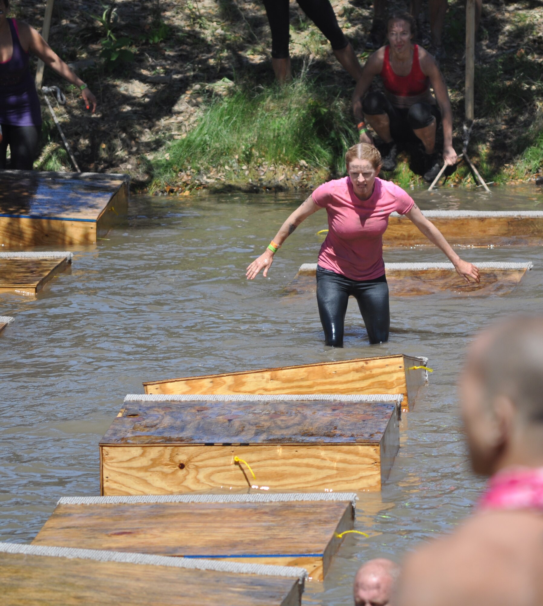 Two 44th Fighter Group members and one active duty 7th Fighter Squadron pilot's spouse from Holloman AFB, New Mexico, competed in the “Tough Mudder” competition in Austin, Texas, Saturday, April 20. Here one team members is traversing a water obstacle but they all ran more than 10 miles facing a total of 22 military obstacles! The Tough Mudder competition is a strong supporter of the Wounded Warrior Foundation. The 44th FG, at Holloman AFB, New Mexico, is a geographically separated unit of the 301st Fighter Wing located at Naval Air Station Fort Worth Joint Reserve Base, Texas. (Courtesy photo)