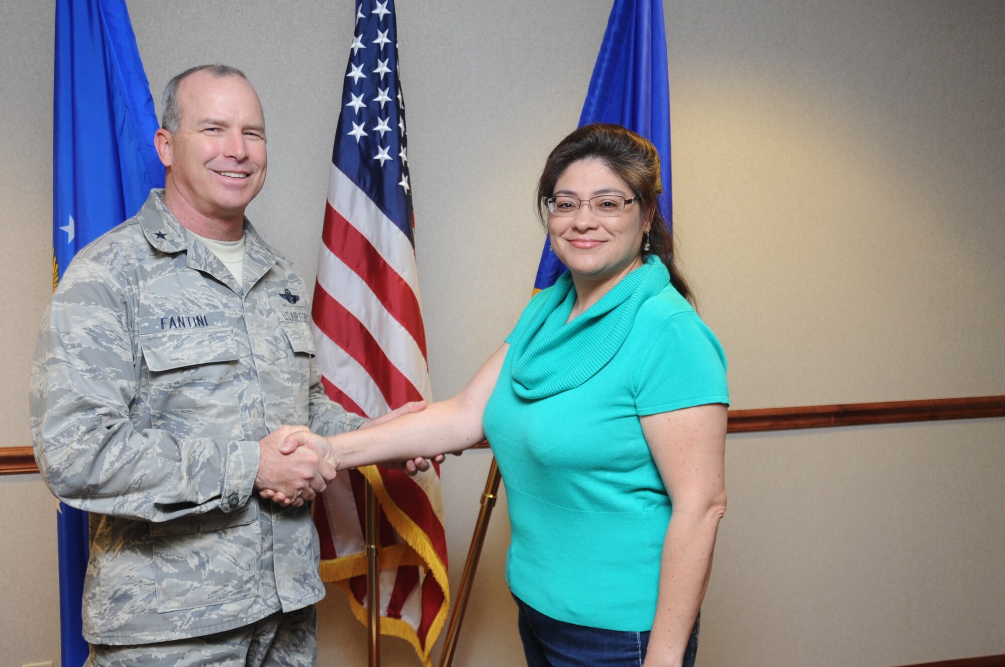 Brig. Gen. Michael Fantini, 82nd Training Wing commander, congratulates Laura Bermudez-Fox, a drug testing program manager for the 82nd Aerospace Medicine Squadron, on being the "Commander's Wingman of Choice." She was selected based on her professionalism and work ethic. (U.S. Air Force photo by Airman 1st Class Jelani Gibson) 
