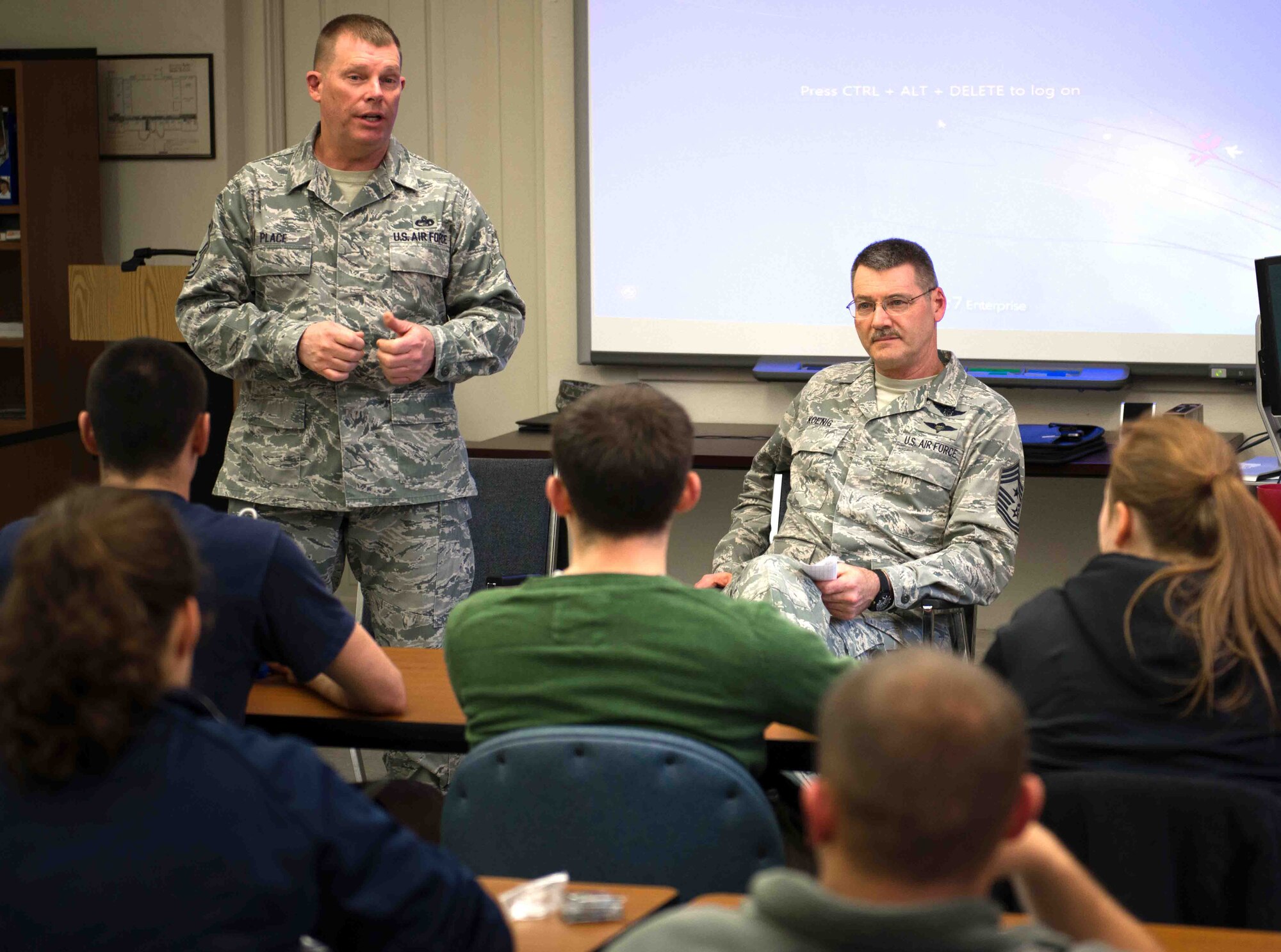 Chief Master Sgts. Dale Place, 27th Aerial Port Squadron (left) and Mark Koenig, 934th Airlift Wing Command Chief, talk with senior Air Force ROTC cadets April 22 from Detachment 415 at the University of Minnesota. (Air Force Photo/Keith Langsdorf)