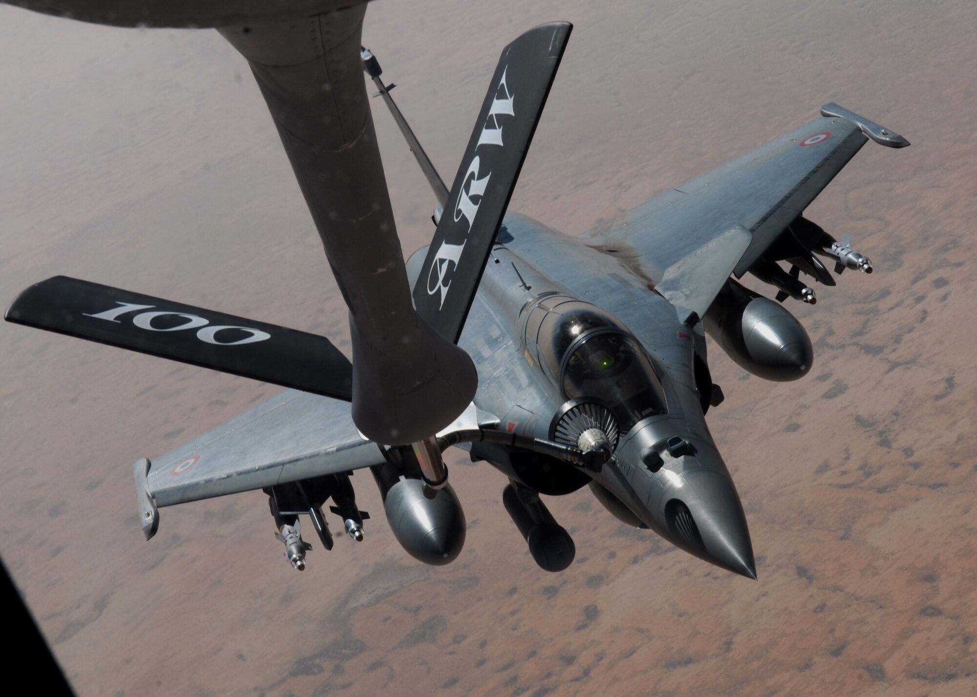 The 351st Expeditionary Air Refueling Wing refuels French Rafale fighter aircraft April 23, 2013, over Mali. The 351st’s Stratotankers have been flying refueling sorties for the French since Jan. 27, 2013, to allow their aircraft to fly close-air-support sorties for troops on the ground in Mali. (U.S. Air Force photo by 1st Lt. Christopher Mesnard/Released)