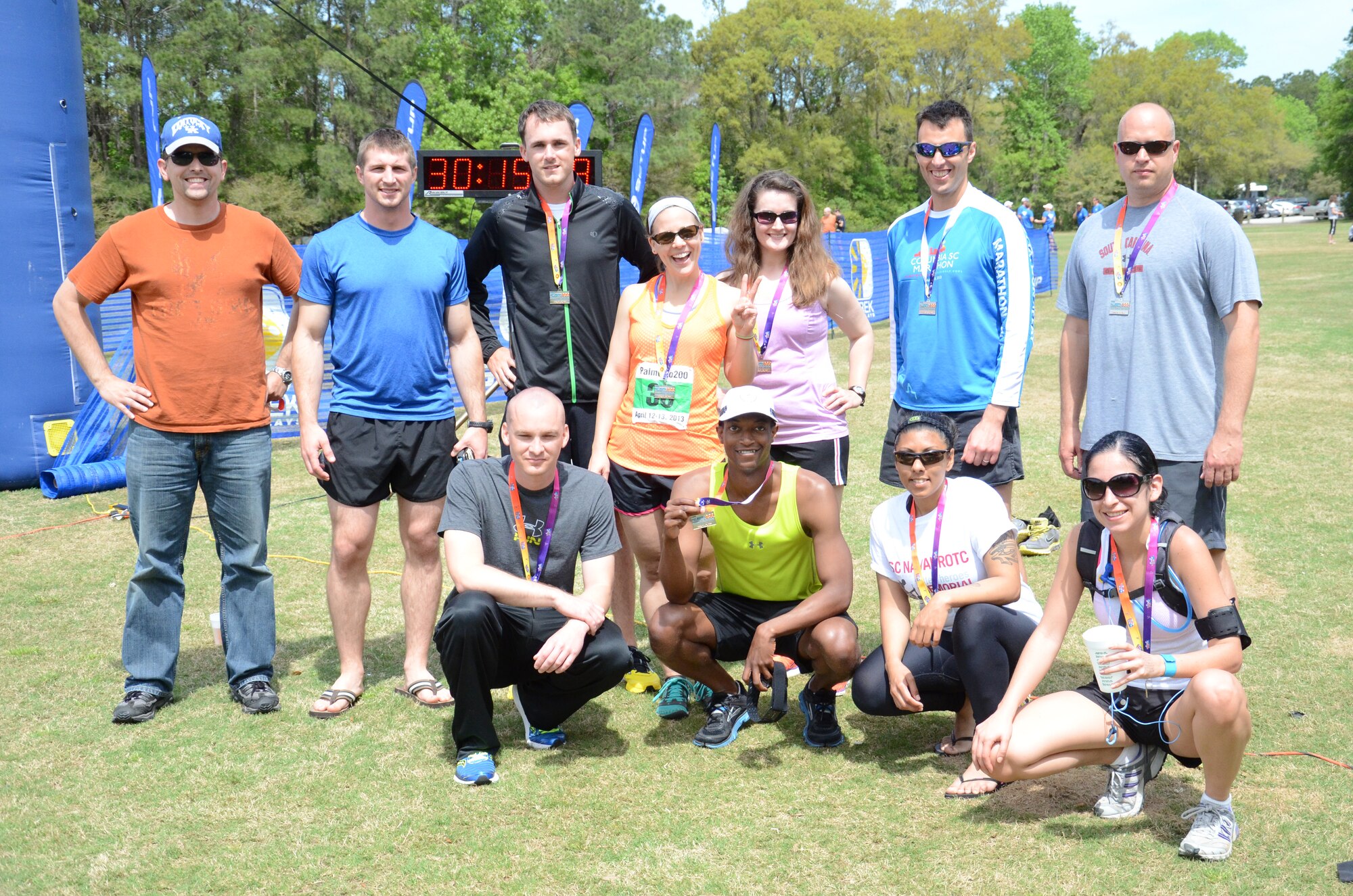The Road Warriors Running Club from Shaw Air Force Base, S.C. poses for a team picture after finishing the Palmetto 200 relay race at James Island, S.C., April 13, 2013. The team covered a total of 198.8 miles between nine runners and two drivers over the course of two days. The teams final time and average pace were 29:13:00 and 8:49 respectively. (U.S. Air Force photo by 2nd Lt. Earon E. Brown/Released)
