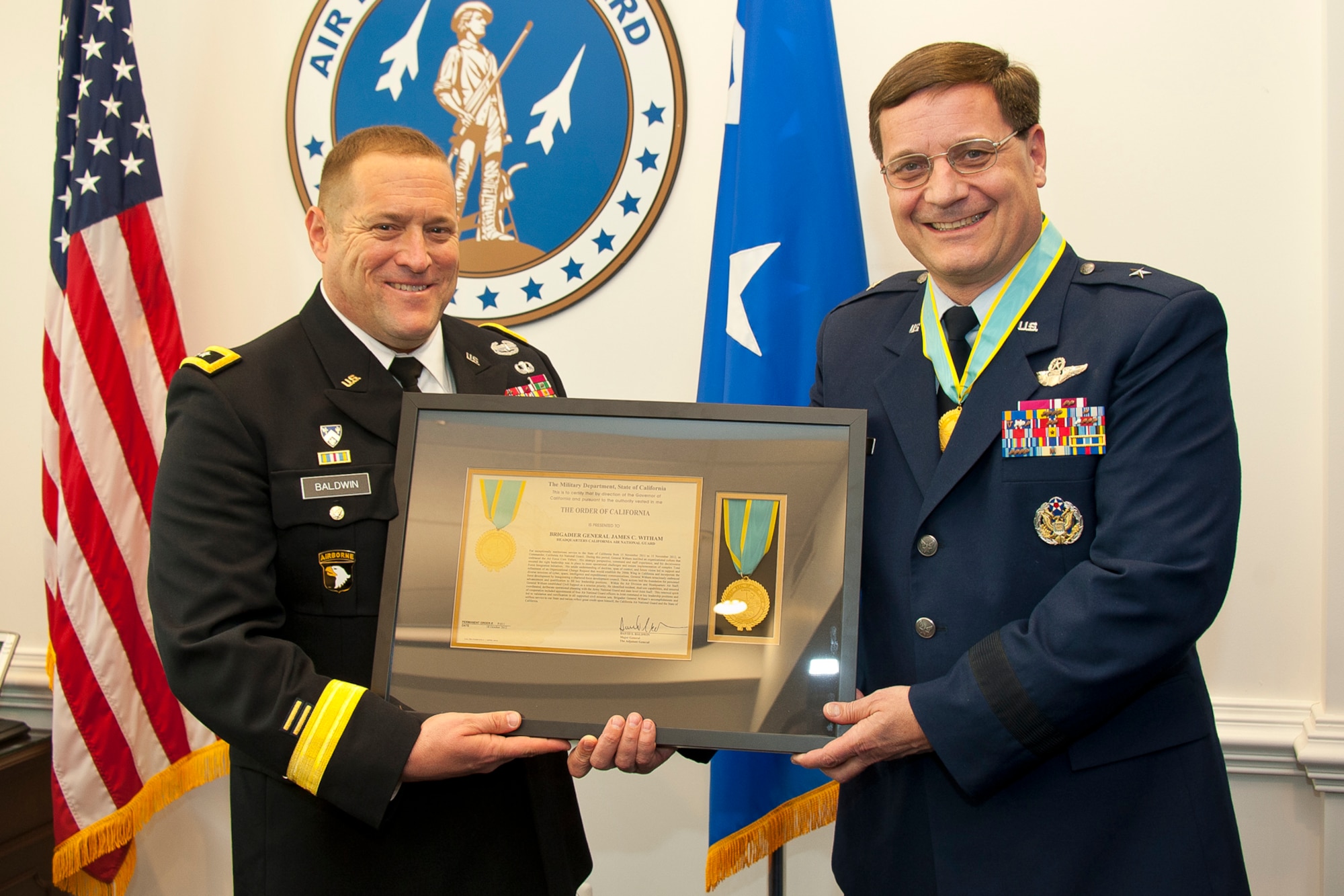 Army Major Gen. David S. Baldwin, the adjutant general of California, presents the Order of California to Air Force Brig. Gen. James C. Witham, the deputy director of the Air National Guard, during a ceremony April 23, 2013 at the Pentagon, D.C. The Order of California, the state’s highest award, is awarded for exceptionally meritorious conduct in the performance of outstanding service to the state of California or the nation by a member of the California National Guard, State Military Reserve, or Naval Militia in a position of great responsibility. (U.S. Air National Guard photo by Master Sgt. Marvin R. Preston/RELEASED)