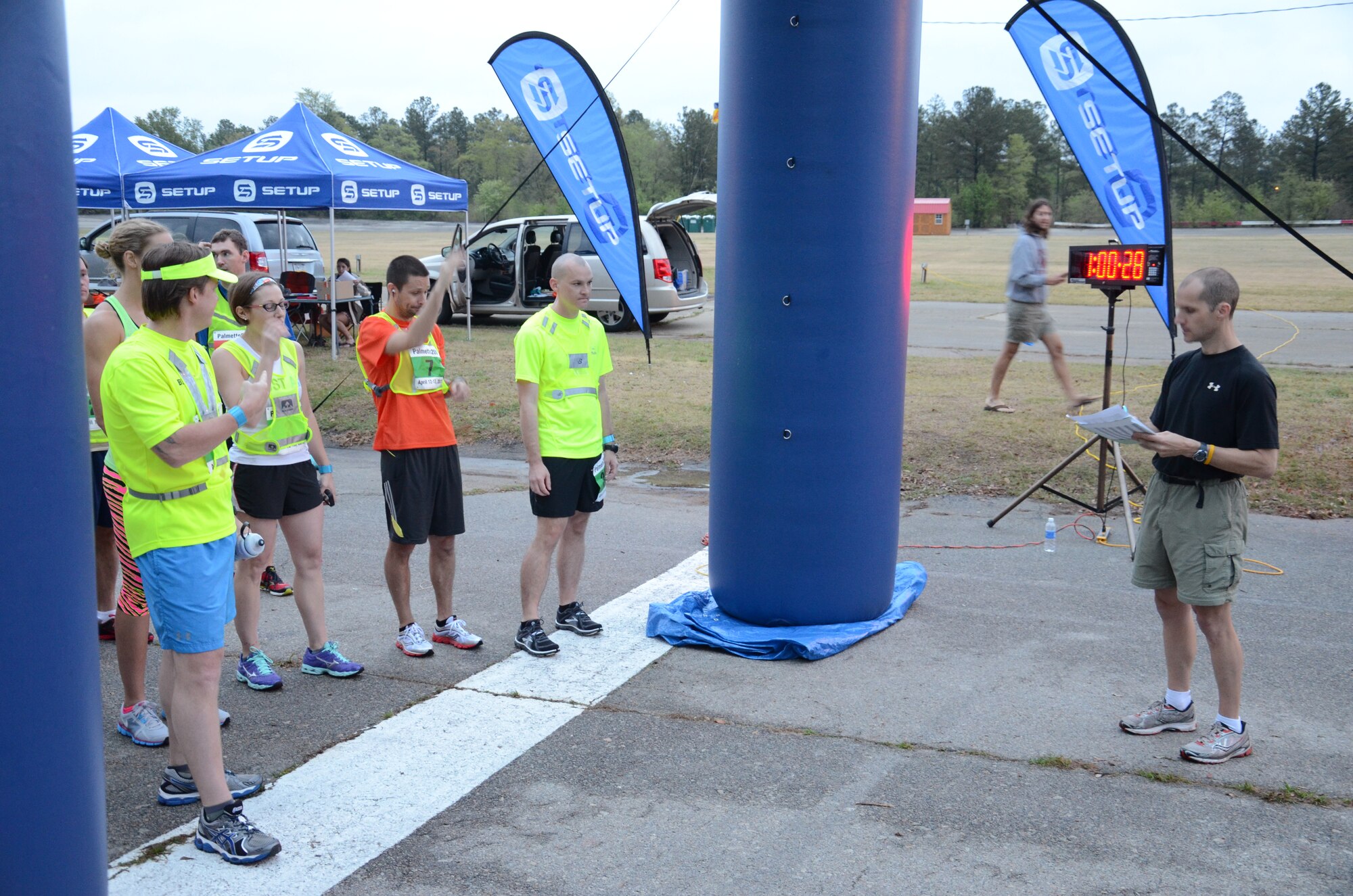 U.S. Air Force Master Sgt. Micki Kistler, 20th Comptroller Squadron and Wing Staff Agencies first sergeant (center), waits for the final countdown to the start of the second heat for the Palmetto 200, April 12, 2013, Cayce, S.C. Kistler is the captain of The Road Warriors Running Club at Shaw Air Force Base which took part in the overnight relay from Columbia, S.C., to Charleston, S.C., earning a time of 29:13:00 and ranking 25th overall. (U.S. Air Force photo by 2nd Lt. Earon E. Brown/Released)