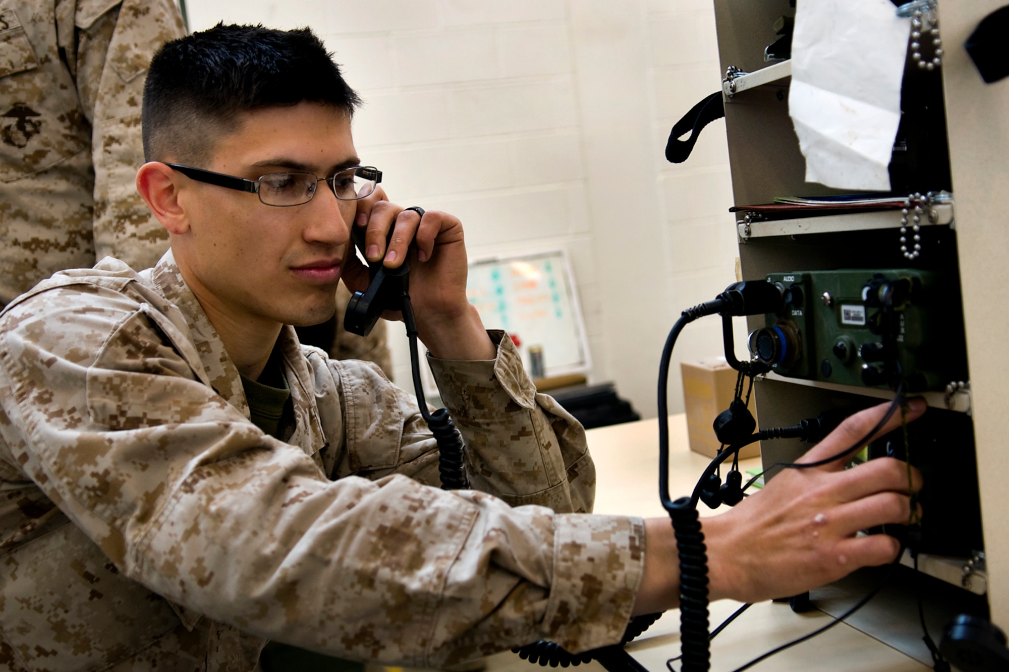 GRISSOM AIR RESERVE BASE, Ind. - Lance Cpl. Joel Reeser, Detachment 1, Communications Company, Headquarters and Service Battalion, 4th Marine Logistics Group communications specialist, operates a radio during a communication exercise here April 13. The exercise was held to help validate the Marines equipment capabilities as well as prepare them for a larger-scale this summer at Camp Lejeune, N.C. (U.S. Air Force photo/Staff Sgt. Ben Mota)
