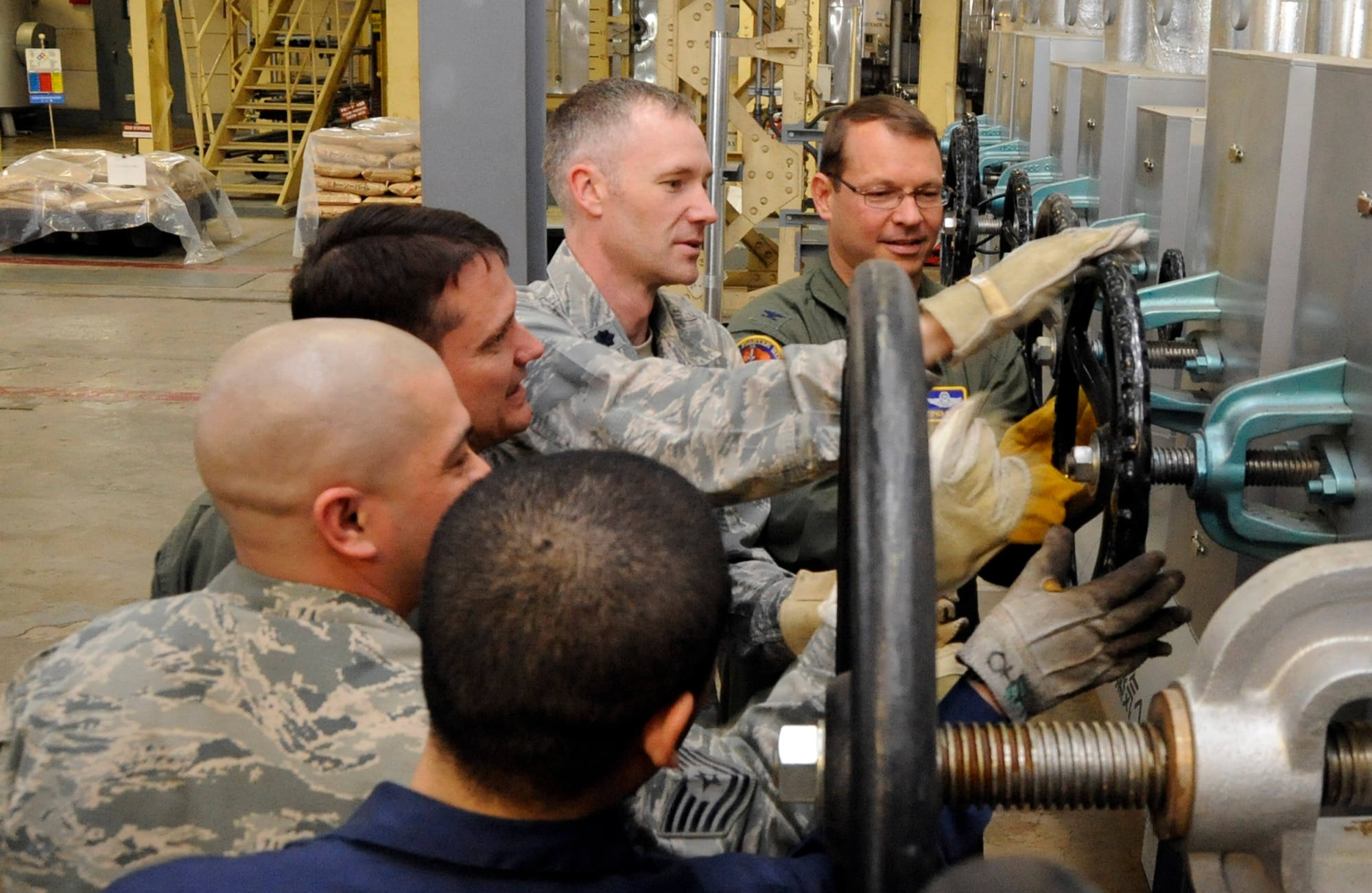 35th Fighter Wing leadership and heat operators shut off the steam lines that heat the industrial buildings seven days early at Misawa Air Base, Japan, April 24, 2013. Although heat in the industrial areas will be shut off, housing ares will still be heated until June 1. (U.S. Air Force photo by Airman 1st Class Kaleb Snay) 