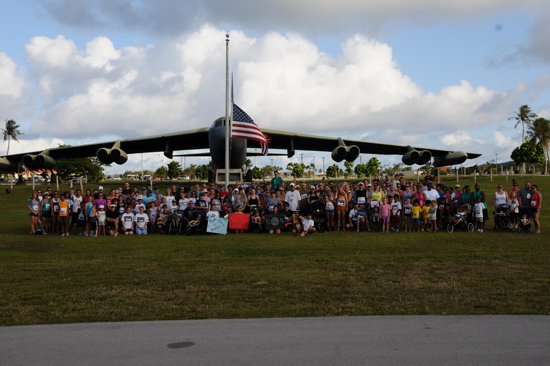 Members of Team Andersen gather for a group photo before the Run 4 Boston memorial event at the Arc Light Memorial on Andersen Air Force Base, Guam, April 21, 2013. Andersen’s running club, Running Dead of Andersen, held the memorial run for Team Andersen to show its support for the victims of the Boston Marathon bombing. (U.S. Air Force photo by Airman 1st Class Emily A. Bradley/Released)