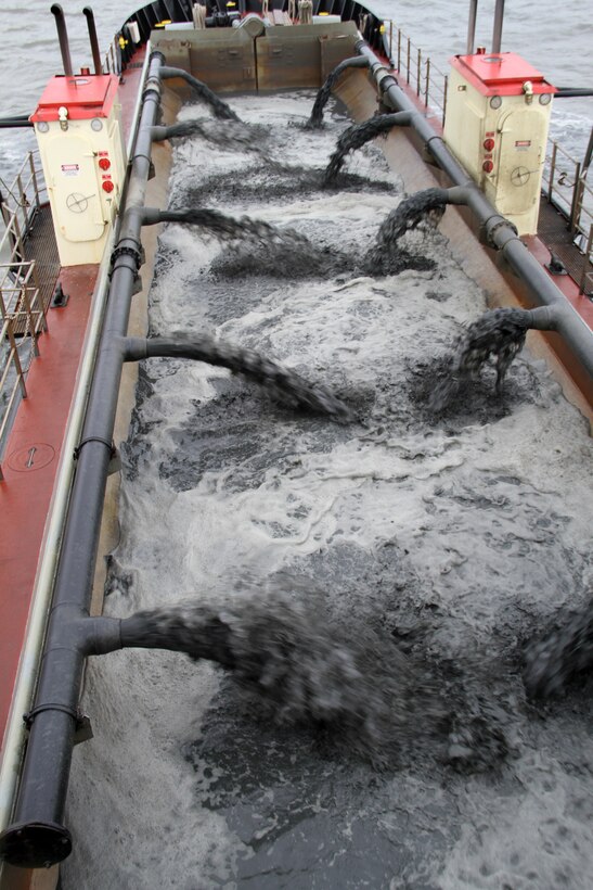 SUFFOLK, Va. -- Pumps from the Army Corps of Engineers’ hopper dredge Currituck, based out of Wilmington, N.C., filters sand from Bennett's Creek to increase the depth from 2 to 6 feet April 23, 2013. The Currituck will place approximately 4,000 cubic yards of sand - equivalent to 450 dump trucks loads –at the Craney Island Dredged Material Management Area in Portsmouth, Va. The shallow-draft dredging of the federal navigation channel here began April 20.