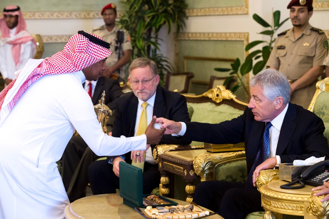 U.S. Defense Secretary Chuck Hagel takes a cup of tea during a farewell tea ceremony with Saudi Arabia’s Prince Fahd bin Abdullah, the country’s deputy defense minister, (not shown) and U.S. Ambassador to Saudi Arabia James B. Smith before departing Riyadh, Saudi Arabia, April 24, 2013. Hagel is on a six-day trip to the Middle East to visit counterparts in Israel, Jordan, Saudi Arabia, Egypt and the United Arab Emirates.