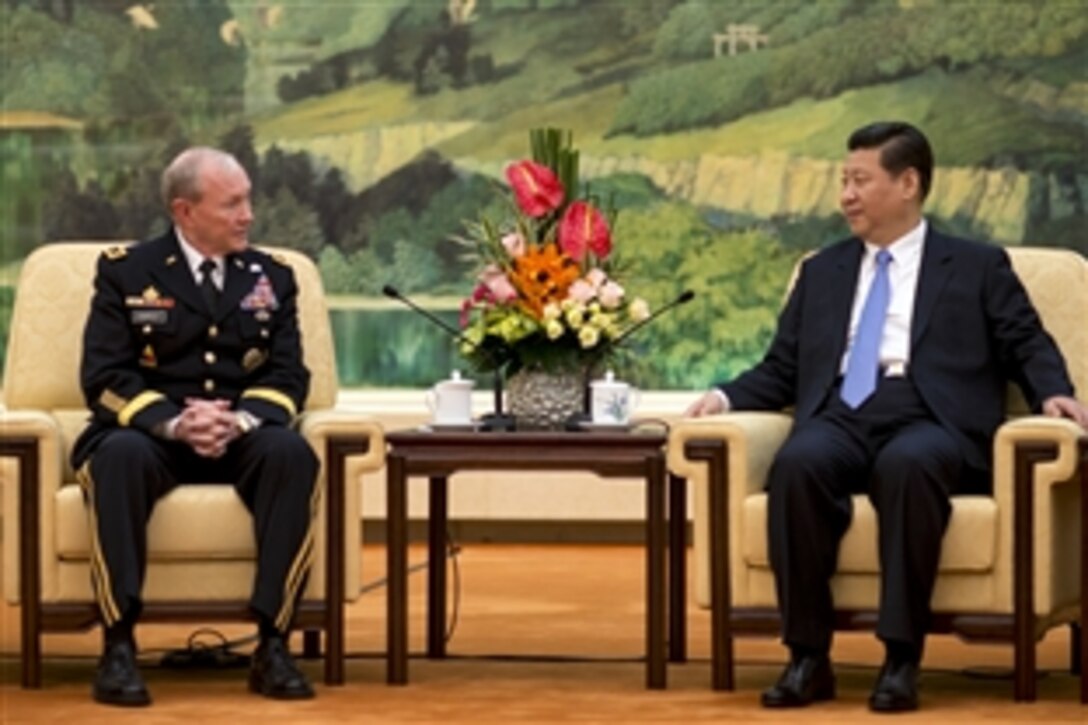 U.S. Army Gen. Martin E. Dempsey, left, chairman of the Joint Chiefs of Staff, meets with Chinese President Xi Jinping in Beijing, April 23, 2013.  