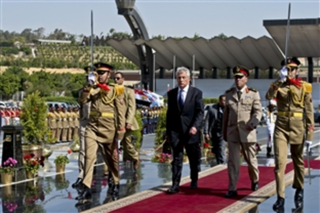 U.S. Defense Secretary Chuck Hagel participates in a wreath-laying ceremony at the Unknown Soldier Memorial in Cairo, April 24, 2013. Egypt is Hagel's fourth stop on a six-day trip to the Middle East to meet with defense counterparts.