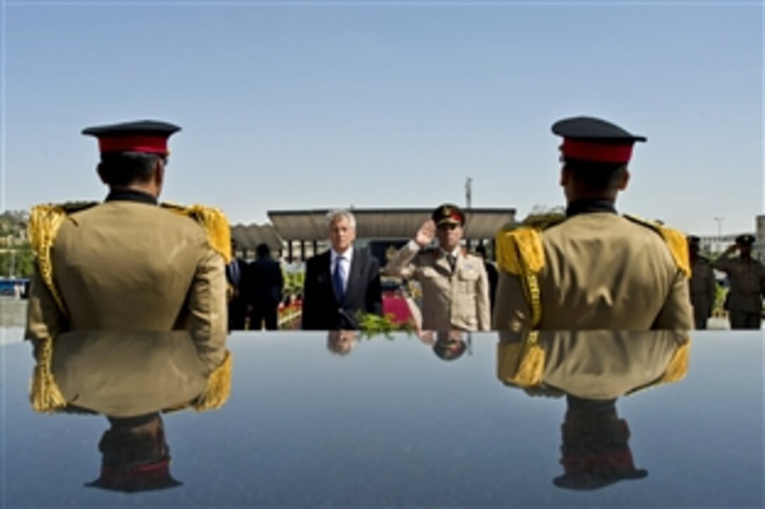 U.S. Defense Secretary Chuck Hagel participates in a wreath-laying ceremony at the Unknown Soldier Memorial in Cairo, April 24, 2013. Egypt is Hagel's fourth stop on a six-day trip to the Middle East to meet with defense counterparts.