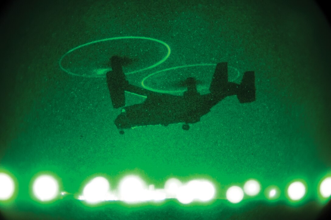 An MV-22B Osprey takes off after refueling during an aviation-delivered ground refueling exercise on Ie Shima April 15. During the exercise, Marines with Marine Aerial Refueler Transport Squadron 152 set up a forward refueling point for day and night refueling. The squadron is a part of Marine Aircraft Group 36, 1st Marine Aircraft Wing, III Marine Expeditionary Force, and the Osprey and crew are assigned to Marine Medium Tiltrotor Squadron 265, MAG-36, 1st MAW, III MEF. Photo by Lance Cpl. Ian McMahon.