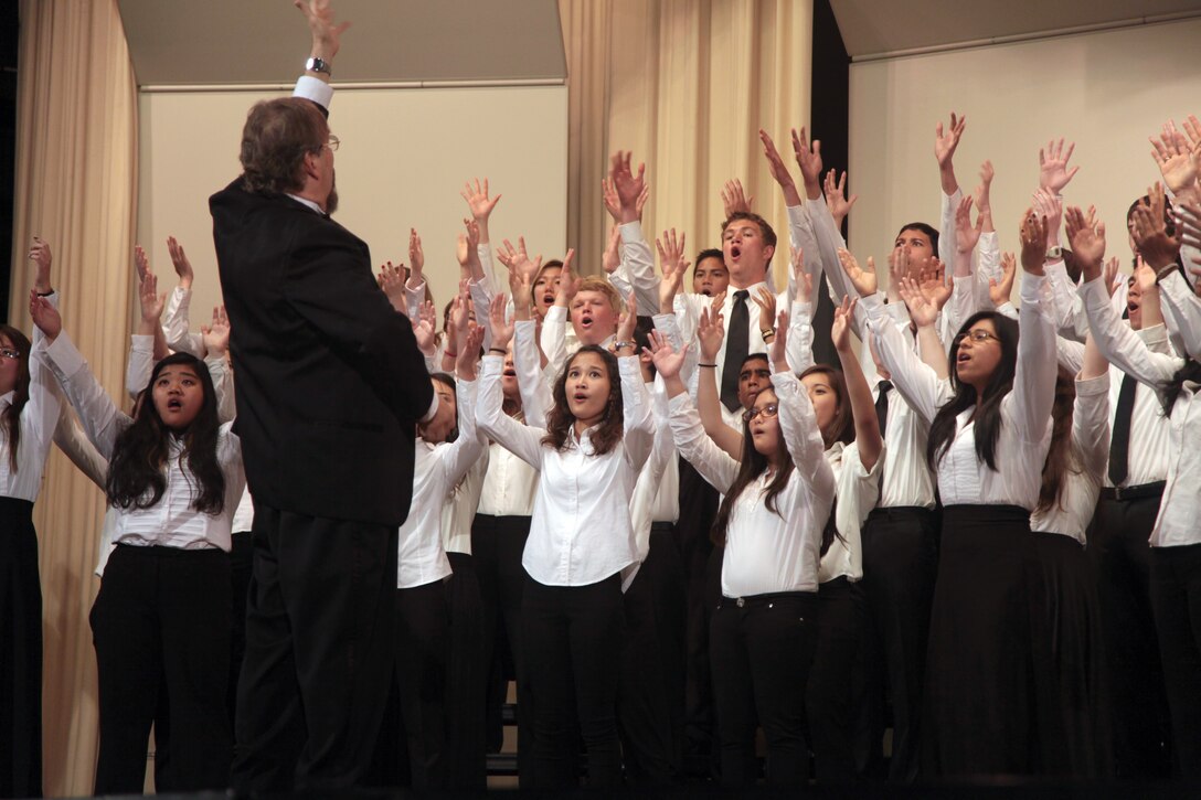High school musicians of the Department of Defense Education Activity Pacific High Schools’ concert choir perform a song for friends, families and guests during the 2013 DODEA Pacific Far East Honor Music Festival Concert at Kubasaki High School on Camp Foster April 19. The event featured live performances by the concert band and choir, and the string orchestra. Photo by Lance Cpl. Brandon C. Suhr
