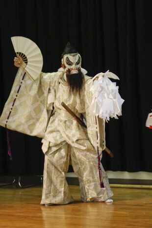 An actor plays the role of Susano-o, a character in the kagura performance at the Japanese American Society Culture Festival held at Matthew C. Perry’s cafeteria here, March 9, 2013. The show, called Yamata-no-Orochi, is based on a Japanese folklore of an eight-headed and eight-tailed serpent. Susano-o was a god banished from the heavens to Earth and is the protagonist in the story.