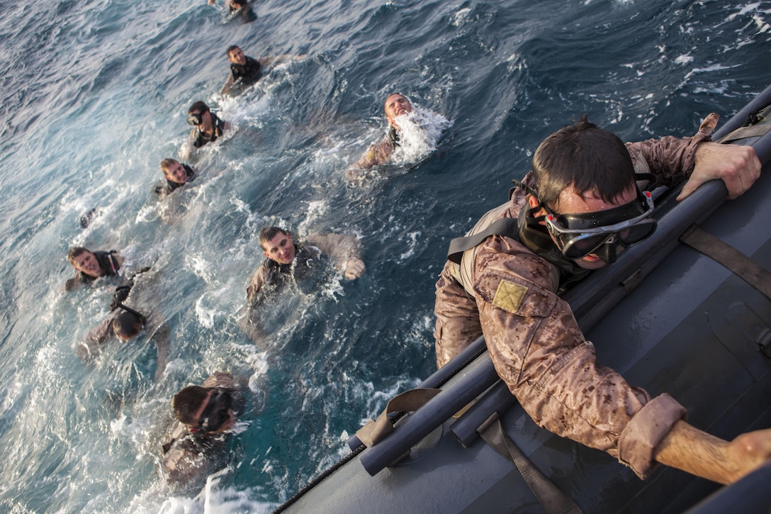 26th Marine Expeditionary Unit (MEU) Maritime Raid Force Marines climb aboard a rigid hull inflatable boat after conducting scout swimming exercises at sea, April 24, 2013. Eagle Resolve is an annual multilateral exercise designed to enhance regional cooperative defense efforts in the Gulf Cooperation Council nations and U.S. Central Command. The 26th MEU is deployed to the 5th Fleet area of operations aboard the Kearsarge Amphibious Ready Group. The 26th MEU operates continuously across the globe, providing the president and unified combatant commanders with a forward-deployed, sea-based quick reaction force. The MEU is a Marine Air-Ground Task Force capable of conducting amphibious operations, crisis response and limited contingency operations.  (U.S. Marine Corps photo by Cpl. Christopher Q. Stone, 26th MEU Combat Camera/Released)