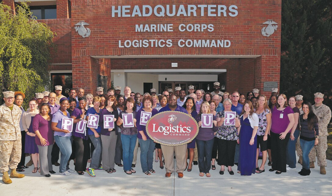 Marines and Civilian-Marines from Marine Corps Logistics Command show their support for “Purple up! For Military Kids,” April 15. April marks the nation’s “Month of the Military Child,” to honor and show appreciation to all military children for their strength and sacrifices.