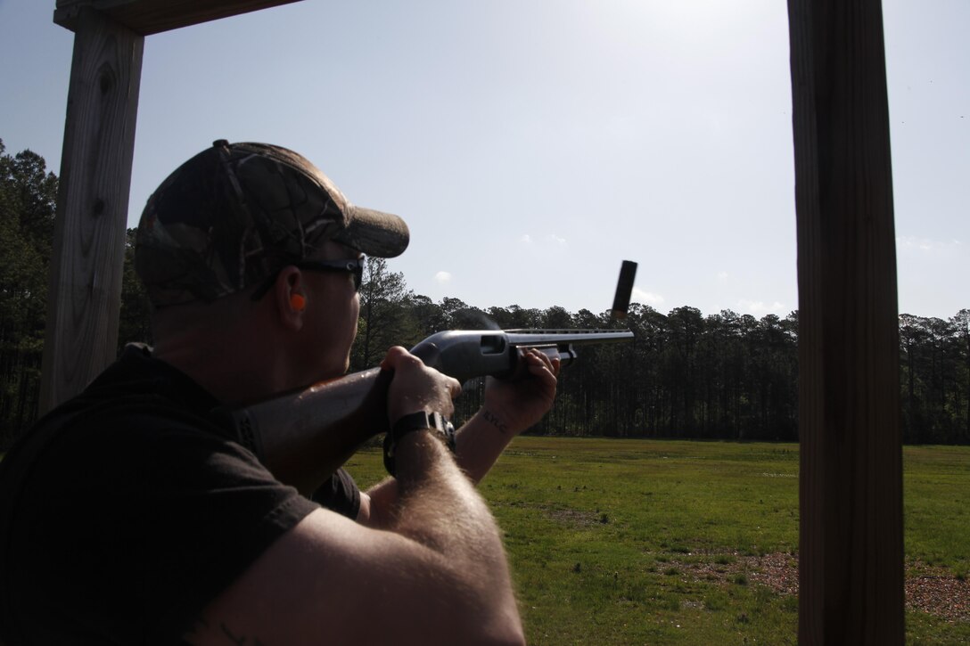 Staff Sgt. James Rust, an intelligence specialist with Marine Aircraft Group 14, fires his shotgun at clay pigeons during the spring fun shoot aboard Cherry Point April 21. Rust said the skeet club is an inexpensive, fun and friendly enviornment with many members active or retired Marines who provide a wealth of knowledge for all Mairnes aboard the air station.