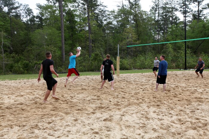 A Marine from Headquarters and Headquarters Squadron serves a volleyball during a game at the Commander's Cup volleyball game, April 19. 
