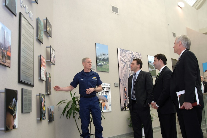 Department of Homeland Security officials stop at the 9-11 tribute wall during a visit to the headquarters of North American Aerospace Defense Command and U.S. Northern Command on Feb. 25, 2008. From left to right are Coast Guard Rear Adm. Dan Lloyd, DHS military advisor; Brian White, DHS chief of staff to deputy secretary; Chad Sweet, DHS chief of staff; and Fred Schwien, DHS executive secretary/executive director for operations and administration. The group came to the commands to meet key staff members and discuss mutual civil support and homeland defense issues. Photo by Sgt. 1st Class Gail Braymen 