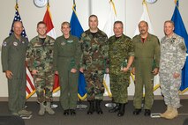 The North American Aerospace Defense Command 2008 2nd quarter military award winners are, left to right: NORAD and U.S. Northern Command Commander Gen. Gene Renuart, Air Force Senior Airman Daniel Montano, Air Force Tech. Sgt. Tracy League, Air Force Master Sgt. Patrick Kincaid, Canadian Forces Lt. Wilfred Hutchings, Canadian Forces Maj. Pierre Viens, NORAD and USNORTHCOM Command Senior Enlisted Leader Command Sgt. Maj. Daniel Wood. Photo by Tech. Sgt. Christopher Gish 