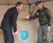 The Honorable Peter MacKay, Canada's Minister of Defence and Gen. Gene Renuart, unveil a time capsule commemorating the 50th Anniversary of NORAD. THe time capsule was placed into a rock from Cheyenne Mountain, home of the historic NORAD command post. The rock will have two commemorative plaques mounted to it, as well as the sealed time capsule, and will not be opened until NORAD's 75th anniversary in 2033. Photo by Sgt. 1st Class Gail Braymen 