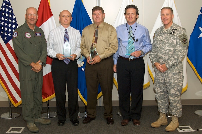 The North American Aerospace Defense Command and U.S. Northern Command 2008 2nd quarter civilian award winners are, left to right: Commander Gen. Gene Renuart, Larry Brenish, Eric Larson, Carl Johnson, NORAD and USNORTHCOM Command Senior Enlisted Leader Command Sgt. Maj. Daniel Wood. Photo by Tech. Sgt. Christopher Gish 
