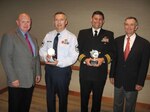 Mr. Glen Pearson, 2008 President of the Society of Manufactuirng Engineers Education Foundation (left) and Mr. Bart Aslin, Director of the foundation (far right) present Senior Master Sgt. Steven Sanchez and Cmdr. Charles Litchfield with the Outstanding Partner Award from the Society of Manufactuirng Engineers Education Foundation Oct. 6. The pair were recognized for their support of the Summer Aerospace Institute as part of NORAD and USNORTHCOM's school partnership agreement with Mitchell High School.
