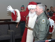 Santa Claus drops in to NORAD Hedquarters Dec. 23rd, 2008, for a pre-flight brief before launching on his annual Christmas eve flight. NORAD Tracks Santa celebrated its 50th year this Christmas, with more than 1200 volunteers answering 73,872 phone calls and 6086 e-mails from children around the world who were eagerly awaiting Santa's visit. the NTS Web site, www.noradsanta.org, also brought in 8,785,186 unique visitors and more than 15-million visits during Santa's around the world journey. Photo by Lt. Cmdr. Gary Ross 