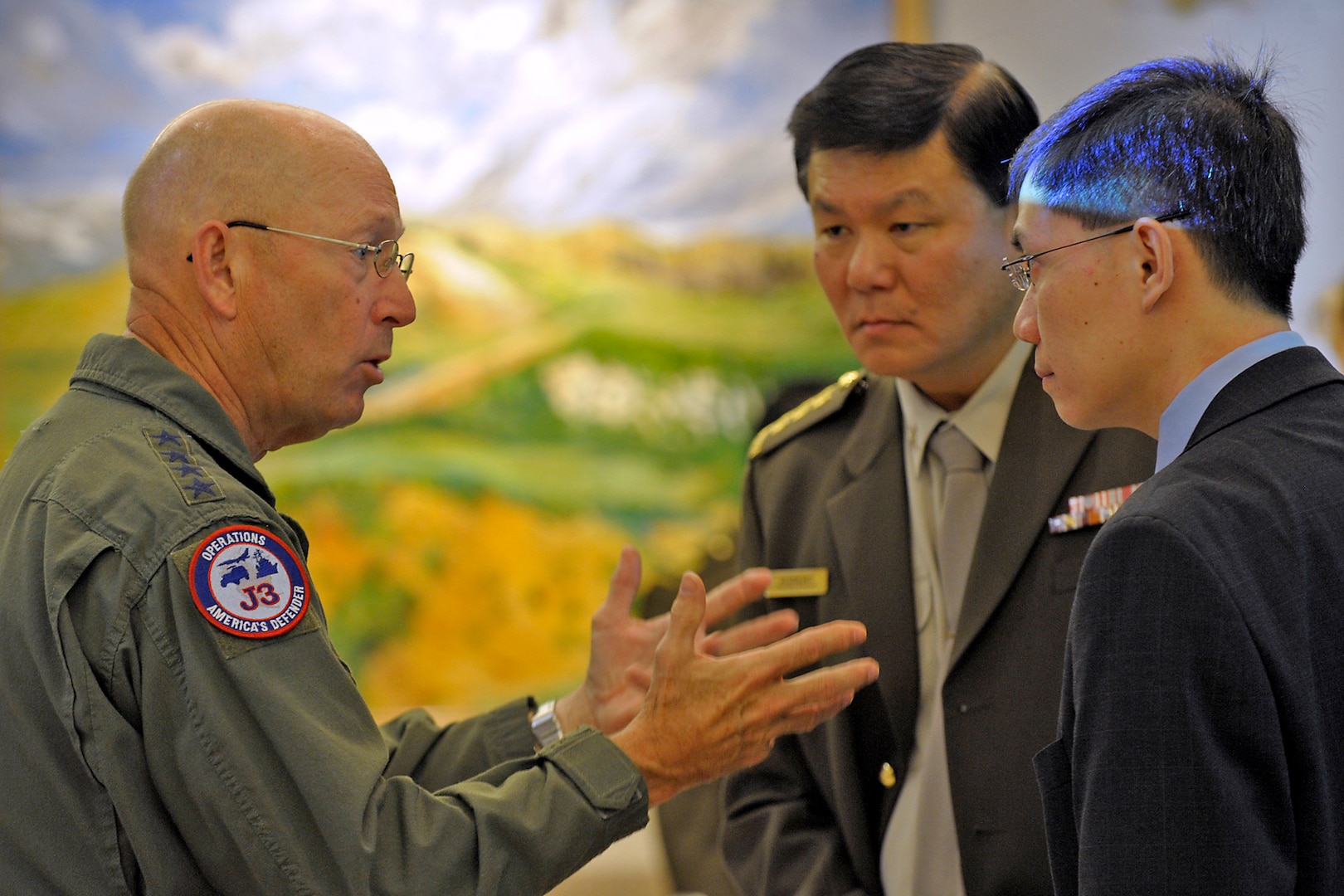 Gen. Gene Renuart, commander of North American Aerospace Defense Command and U.S. Northern Command, talks with military and civilian representatives from Singapore at NORAD’s and USNORTHCOM’s Homeland Defense and Civil Support Perspectives Forum in Colorado Springs, Colo., Oct. 31, 2008. About 60 officials from Australia, Canada, Mexico, Norway, Singapore, the United Kingdom and the United States met to discuss methods of and ways to improve Homeland Defense and Civil Support processes. Photo by Sgt. 1st Class Gail Braymen
