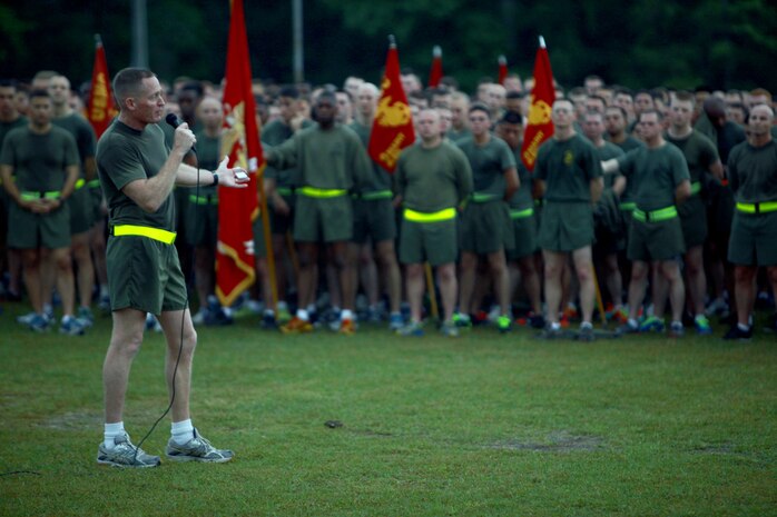 Brig. Gen. Edward D. Banta, the commanding general of 2nd Marine Logistics Group speaks to Marines and sailors with the unit about current events happening to servicemembers with the unit overseas after a three-mile run aboard Camp Lejeune, N.C., April 25, 2013. Banta told the servicemembers “there is absolutely nothing like being ahead of a formation and seeing about 3,500 Marines and sailors going down the road. If the base didn’t know that the MLG was around before, today they definitely knew and made your presence known.” 