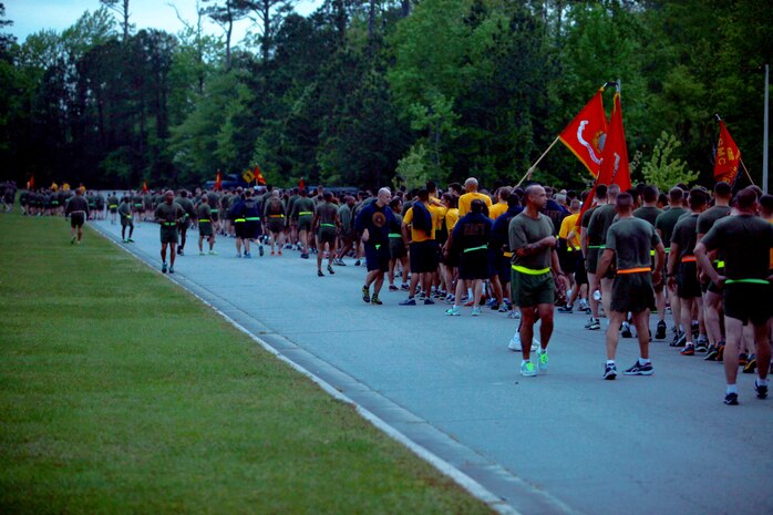 Marines and sailors with 2nd Marine Logistics Group arrive at Soifert field after completing a unit run aboard Camp Lejeune, N.C., April 25, 2013. Brig. Gen. Edward D. Banta, the commanding general of 2nd MLG led the servicemembers from the front of the formation as they ran around the base.