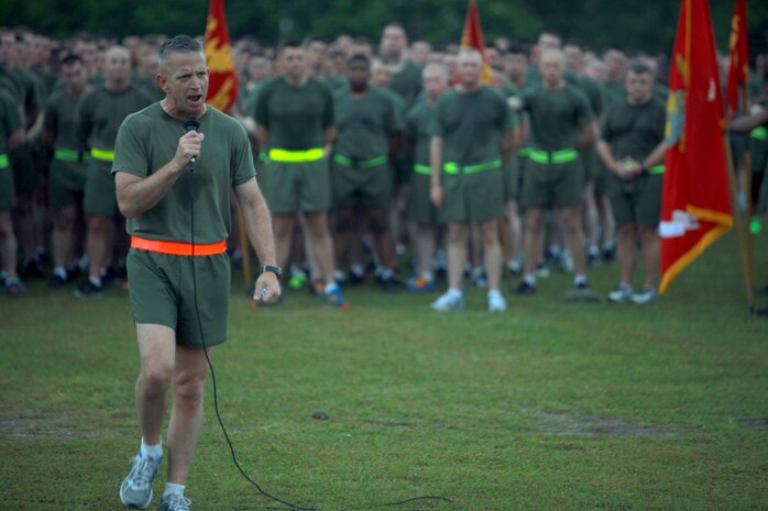 Sgt. Maj. George W. Young Jr., the sergeant major of 2nd Marine Logistics Group, speaks to Marines and sailors with the unit after a unit three-mile run aboard Camp Lejeune, N.C., April 25, 2013. Young inspired the servicemembers to make sure they are doing the right thing even when no one is looking. 