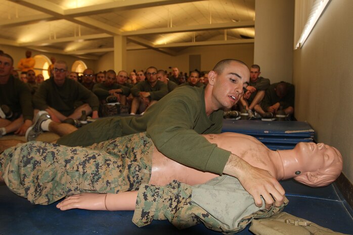 A recruit with Company E, 2nd Recruit Training Battalion, practices combat care on a simulated casualty aboard Marine Corps Recruit Depot San Diego April 8. Recruits received an approximate one hour review in order to help prepare them for a combat care test. The test will require recruits to properly diagnose and treat an injury on a simulated casualty.