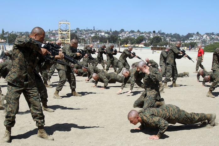 Recruits of Company A, 1st Recruit Training Battalion, practice Marine Corps Martial Arts Program techniques during a training event aboard Marine Corps Recruit Depot San Diego April 11. Counter techniques are taught to help recruits defend themselves in the event an enemy attempts to take their weapon. 