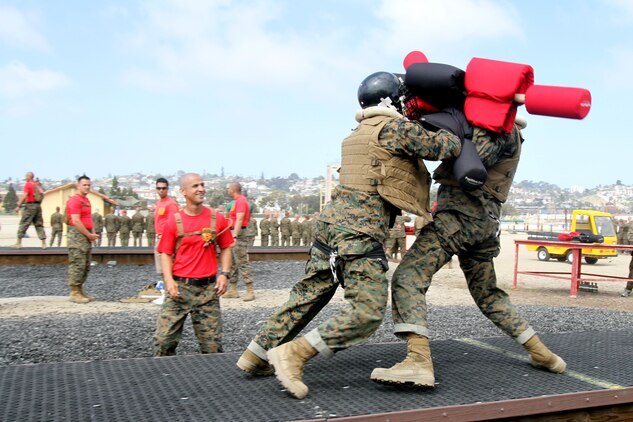 Recruits with Company A, 1st Recruit Training Battalion, face-off during a pugil sticks match aboard Marine Corps Recruit Depot San Diego April 11. Recruits must rely on Marine Corps Martial Arts Program techniques and confidence gained throughout recruit training to defeat their opponet. 