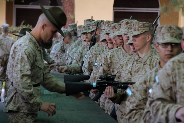 A Company K drill instructor makes sure each rifle is labeled correctly during rifle issue aboard Marine Corps Recruit Depot San Diego April 8. Every recruit is responsible for their M-16 A4 service rifle during recruit training.