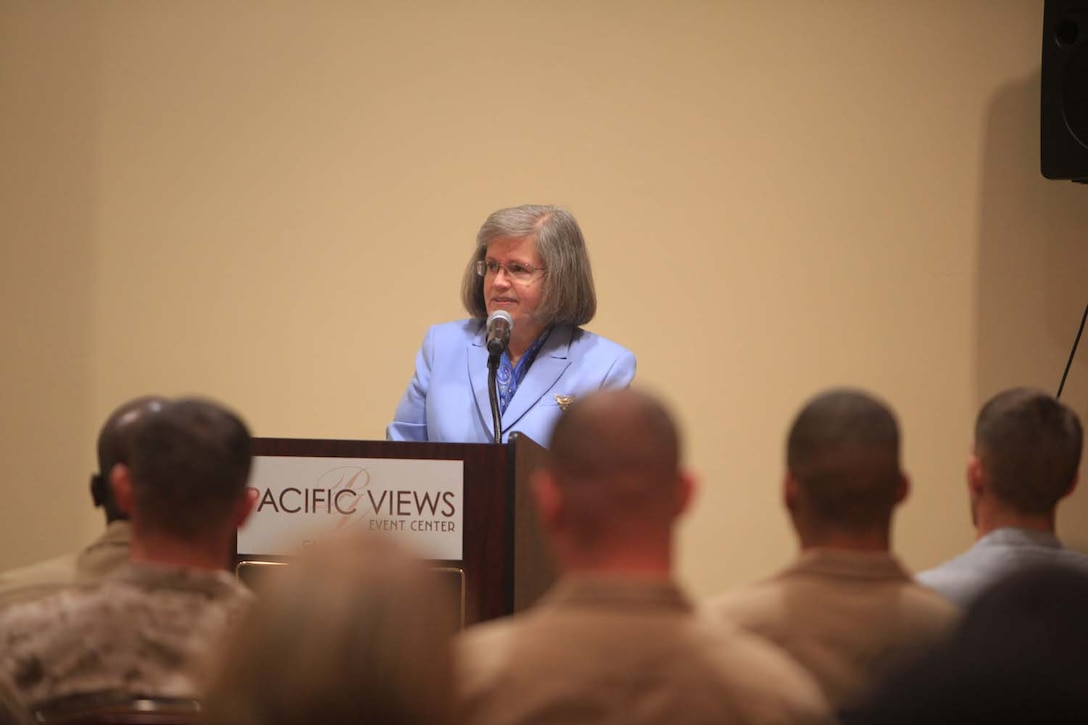 Holly Petraeus, the assistant director for the Office of Servicemember Affairs of Consumer Financial Protection Bureau, addresses the crowd during a town hall meeting on Camp Pendleton, Calif., April 12.  Petraeus touched on many subjects to include the scams used to defraud service members, programs available to aid veterans and their families and ways to enhance financial stability.