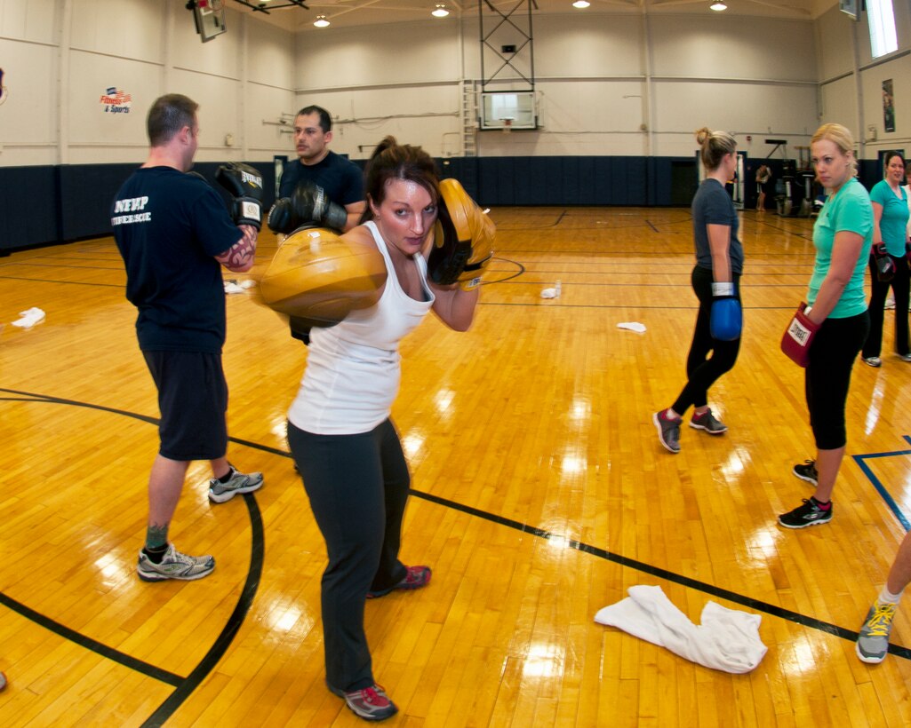 Master Sgt. Charity Edwards, 914th Force Support Squadron First Sergeant uses her skills as a certified physical trainer during a fitness class offered at the Niagara Falls Air Reserve Station Fitness Center, April 11, 2013, Niagara Falls, N.Y. The class utilizes free weights, spinning bikes, aerobic steps, kettlebells, medicine balls, suspension straps, stability balls, BOSU trainers, yoga and martial arts techniques; No two workout sessions are the same. (U.S. Air Force photo by Tech. Sgt. Joseph McKee)