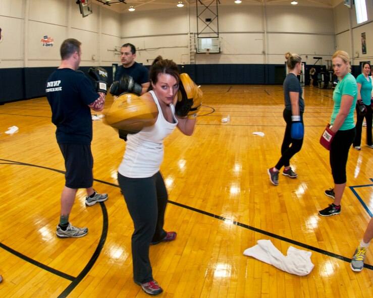Master Sgt. Charity Edwards, 914th Force Support Squadron First Sergeant uses her skills as a certified physical trainer during a fitness class offered at the Niagara Falls Air Reserve Station Fitness Center, April 11, 2013, Niagara Falls, N.Y. The class utilizes free weights, spinning bikes, aerobic steps, kettlebells, medicine balls, suspension straps, stability balls, BOSU trainers, yoga and martial arts techniques; No two workout sessions are the same. (U.S. Air Force photo by Tech. Sgt. Joseph McKee)