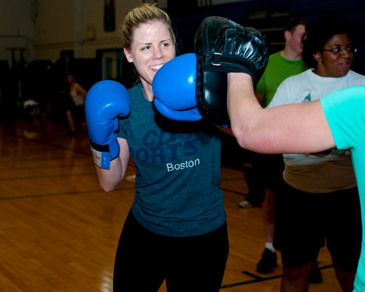 Members of the Niagara Falls Air Reserve Station engage in a fitness class offered at the Fitness Center, April 11, 2013, Niagara Falls, N.Y. The class utilizes free weights, spinning bikes, aerobic steps, kettlebells, medicine balls, suspension straps, stability balls, BOSU trainers, yoga and martial arts techniques; No two workout sessions are the same. (U.S. Air Force photo by Tech. Sgt. Joseph McKee)