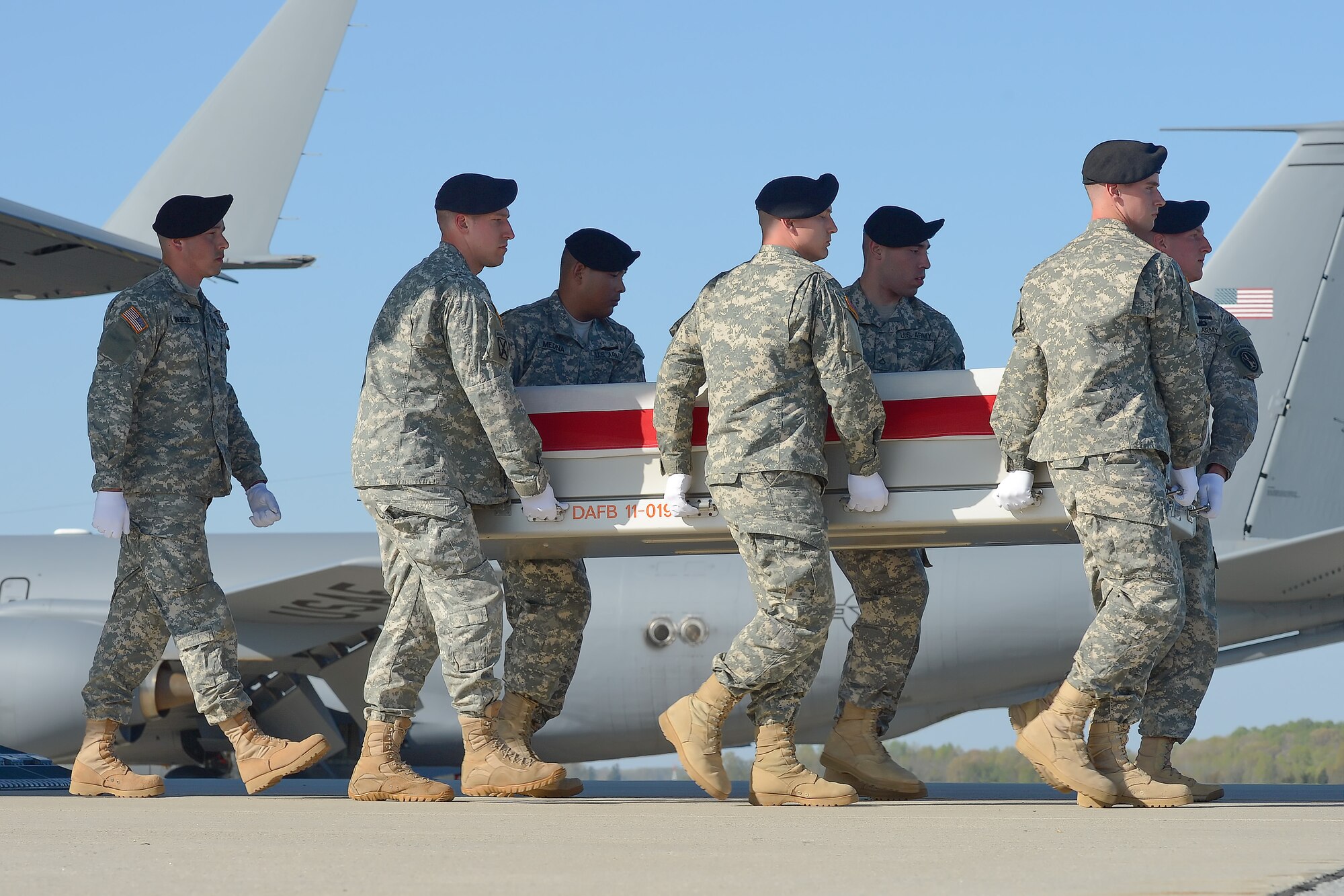 A U.S. Army carry team transfers the remains of Army Capt. Aaron R. Blanchard, of Selah, Wash., during a dignified transfer April 25, 2013, at Dover Air Force Base, Del. Blanchard was assigned to Headquarter and Headquarters Company, 2nd Aviation Battalion, 10th Combat Aviation Brigade, Ft. Drum, N.Y. (U.S. Air Force photo/Greg L. Davis)