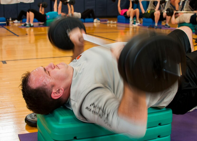 Members of the Niagara Falls Air Reserve Station engage in a fitness class offered at the Fitness Center, April 11, 2013, Niagara Falls, N.Y. The class utilizes free weights, spinning bikes, aerobic steps, kettlebells, medicine balls, suspension straps, stability balls, BOSU trainers, yoga and martial arts techniques; No two workout sessions are the same. (U.S. Air Force photo by Tech. Sgt. Joseph McKee)