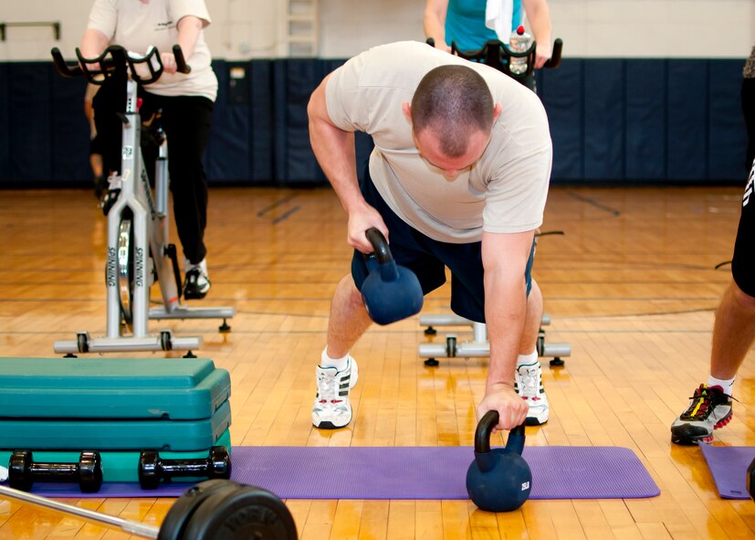 Members of the Niagara Falls Air Reserve Station engage in a fitness class offered at the Fitness Center, April 11, 2013, Niagara Falls, N.Y. The class utilizes free weights, spinning bikes, aerobic steps, kettlebells, medicine balls, suspension straps, stability balls, BOSU trainers, yoga and martial arts techniques; No two workout sessions are the same. (U.S. Air Force photo by Tech. Sgt. Joseph McKee)