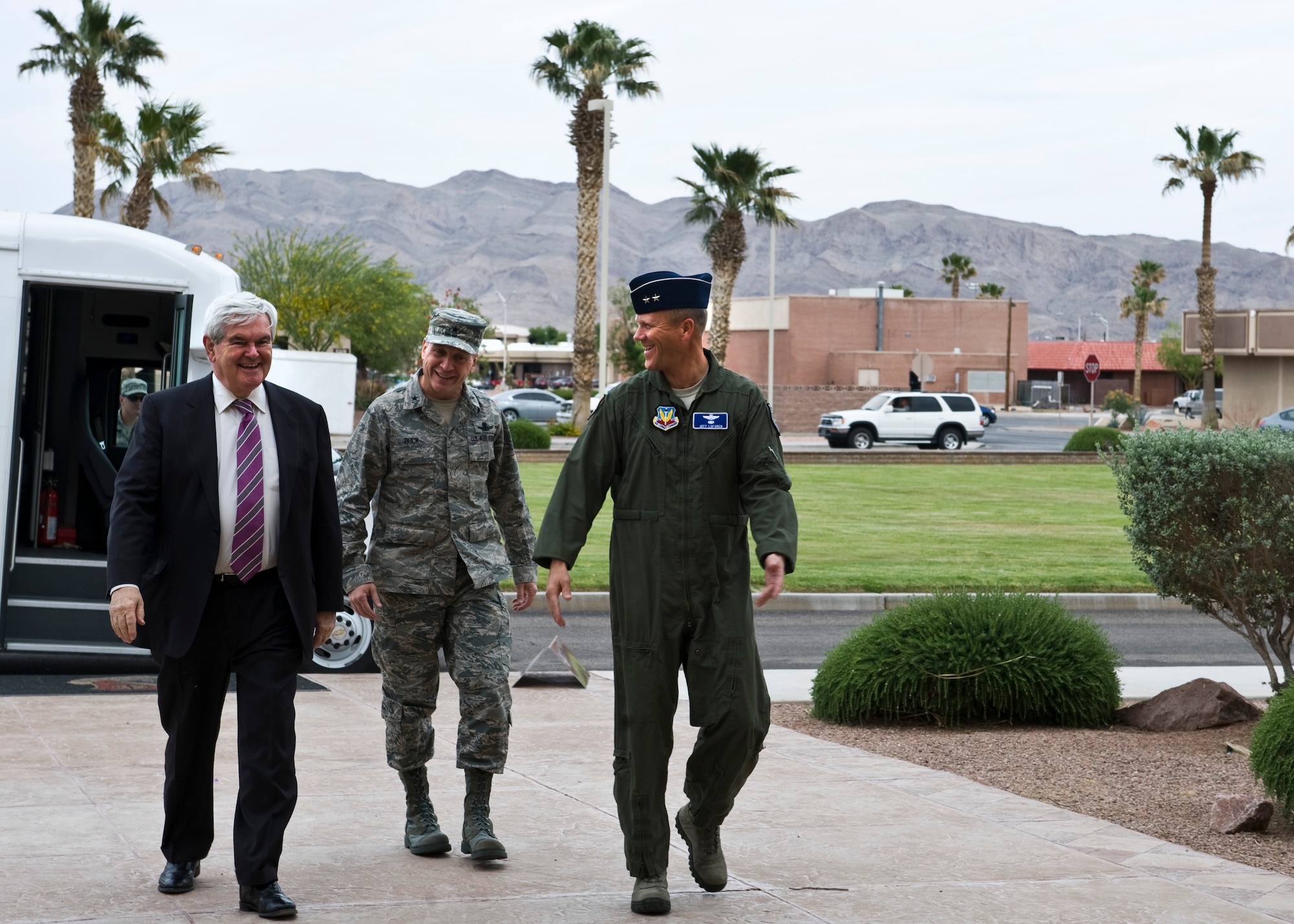 From left to right: Newt Gingrich, former speaker of the U.S. House of Representatives; Brig. Gen. David Buck, United States Air Force Warfare Center vice commander; and Maj. Gen. Jeffrey Lofgren, USAFWC commander, walk into the USAFWC headquarters building, April 24, 2013, at Nellis Air Force Base, Nev.  Gingrich served as the 58th speaker of the U.S. House Of Representatives from 1995 to 1999 and was also a candidate for the 2012 Republican Party presidential nomination. (U.S. Air Force Photo by Airman 1st Class Jason Couillard)



